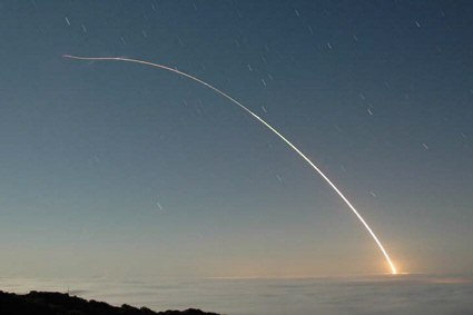 A Minuteman III ICBM heads downrange following launch from Vandenberg AFB