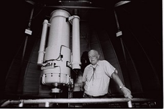 Ray White Jr. stands next to the University of Arizona telescope to be renamed in his honor.