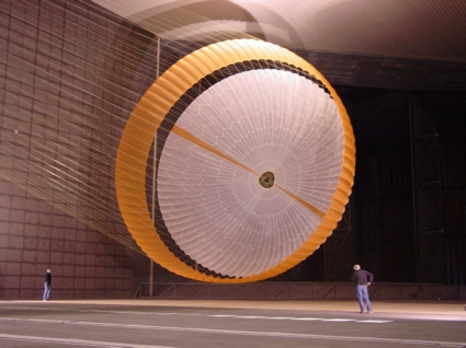 Engineers test a Mars parachute inside a wind tunnel at NASA Ames Research Center