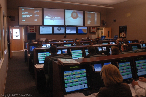 A government-industry team monitors the Pegasus XL rocket / AIM satellite launch